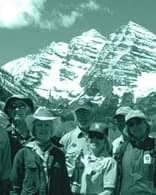 Uniformed Forest Conservancy volunteers in front of the Maroon Bells